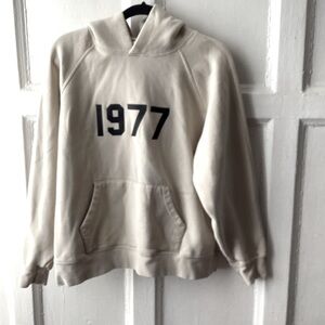 Essentials Fear of God Cream Hoodie with Black 1977 Print